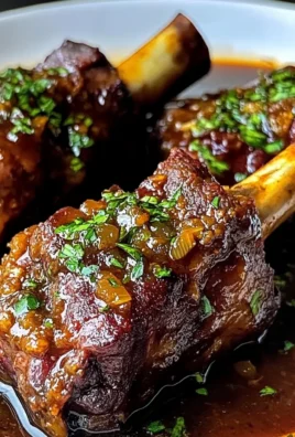 Braised Lamb Shanks in Red Wine and Herb Sauce